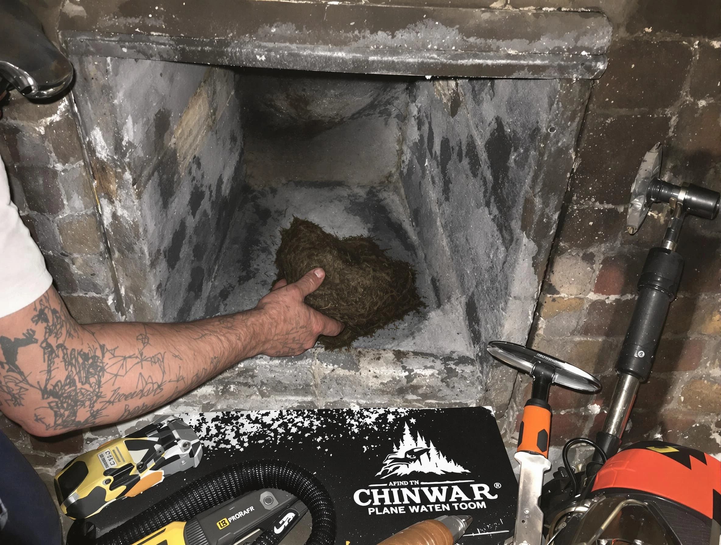 Blackstone Chimney Sweep safely removing debris and screening chimney in Blackstone, VA